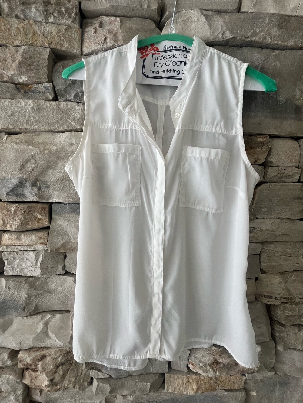 Sleeveless silky white blouse